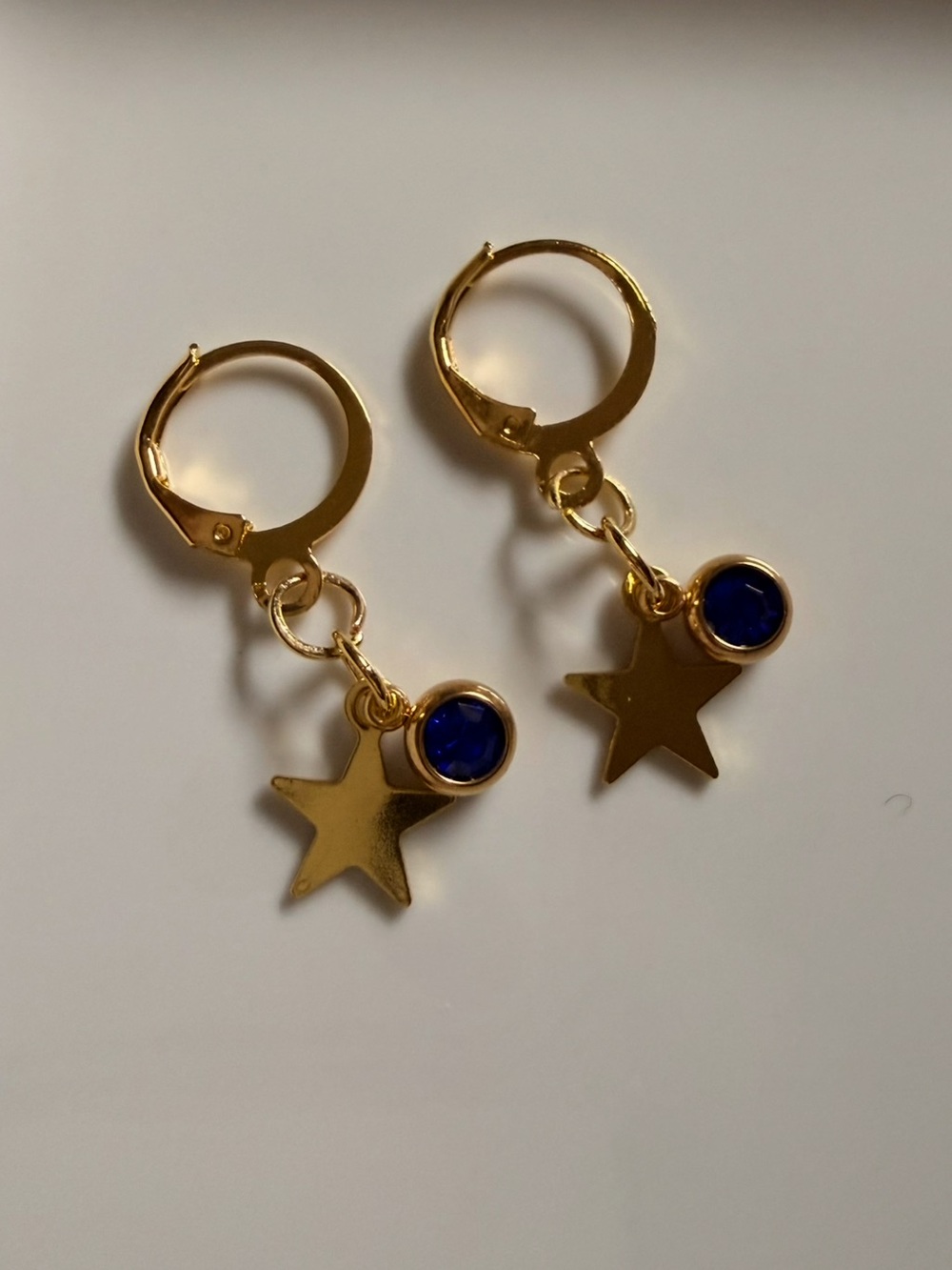 Gold Star Hoop Earrings with Deep Blue Accent